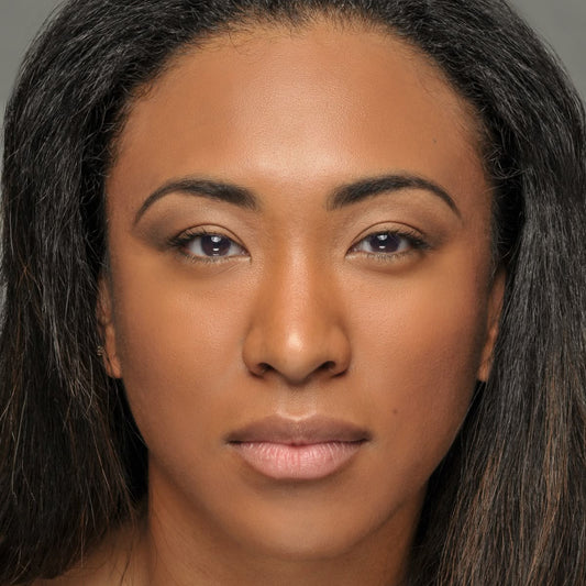 Close-up of a person with shoulder-length hair against a neutral background