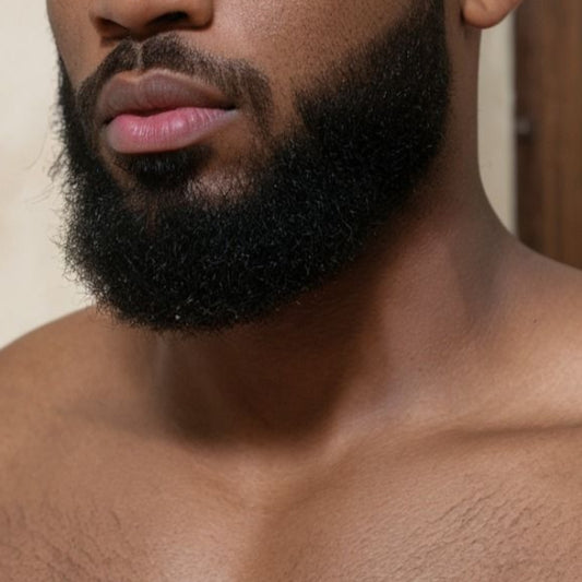 Man with a beard and short hair against a neutral background