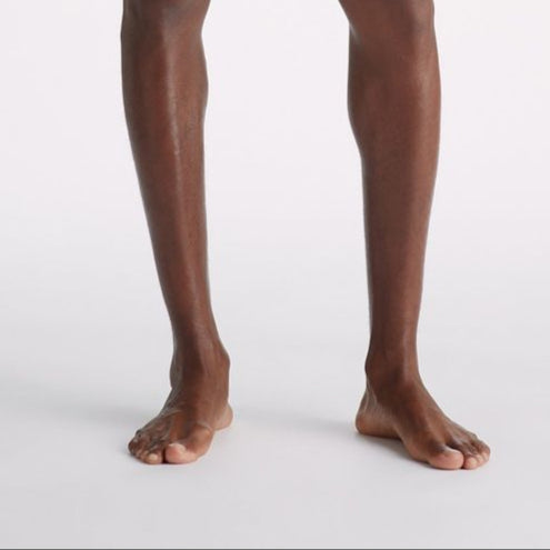 Man wearing black underwear on a white background